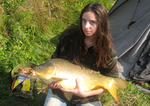 one of many portraits of happy fishermen with the carp they've just caught