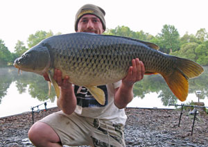one of many portraits of happy fishermen with the carp they've just caught