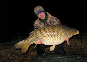 one of many portraits of happy fishermen with the carp they've just caught