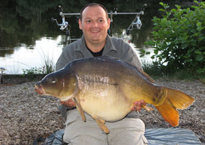 one of many portraits of happy fishermen with the carp they've just caught