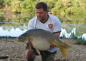 one of many portraits of happy fishermen with the carp they've just caught