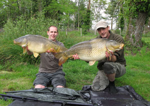 one of many portraits of happy fishermen with the carp they've just caught